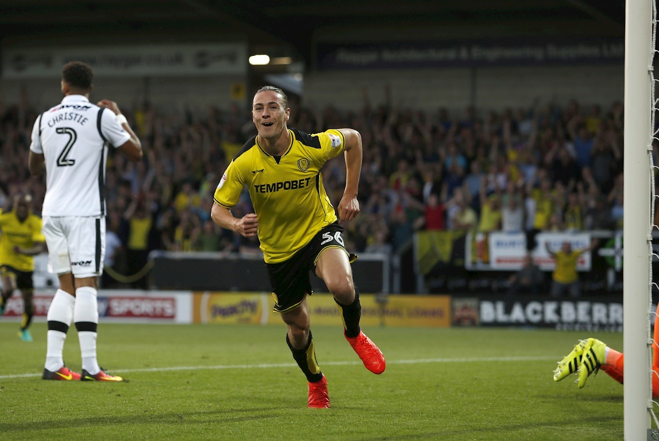JACKSON Irvine celebrates putting Burton Albion 1-0 ahead in our first ever competitive game