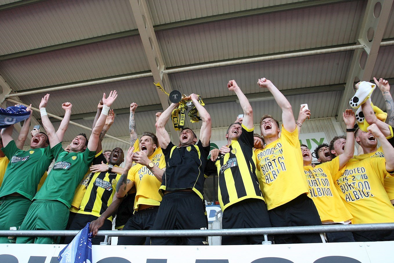 Captain John Mousinho lifts the promotion trophy as Burton Albion celebrate reaching the Sky Bet Championship in front of our fans at Doncaster Rovers