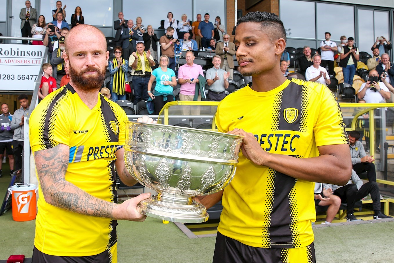 John Brayford and Michael Mancienne lift the Bass Charity Vase following our victory over Leicester City (on penalties) in July 2021