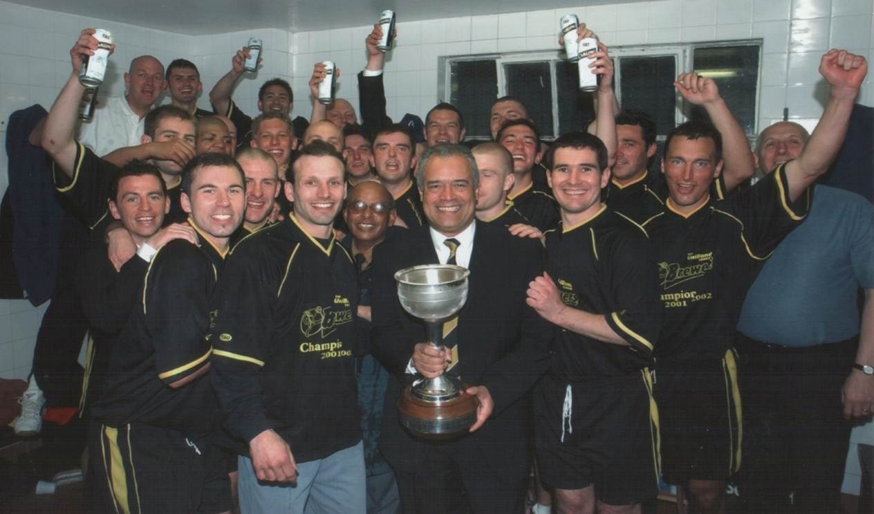 Chairman Ben Robinson holds the Unibond Premier Division trophy after Burton Albion win promotion as league champions to the Conference in 2002