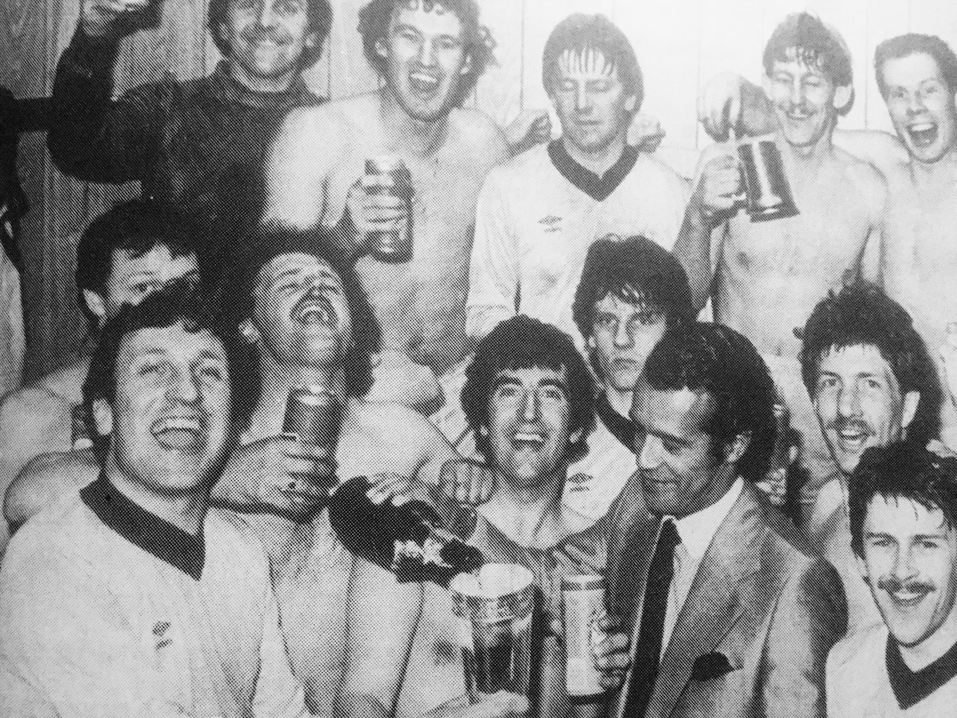 Burton Albion manager Neil Warnock and Chairman Ben Robinson, with the first team squad, celebrate winning the Northern Premier League Cup in 1983.