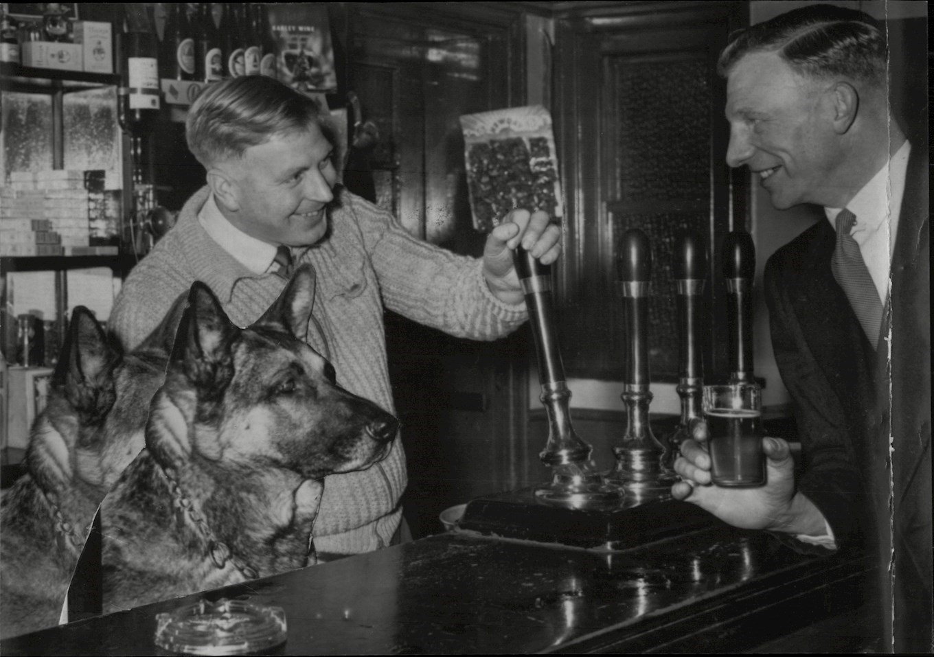 Burton Albion FC Captain Reg Weston (r) Is Served A Drink By Goalkeeper Bill Townsend At His Public House.